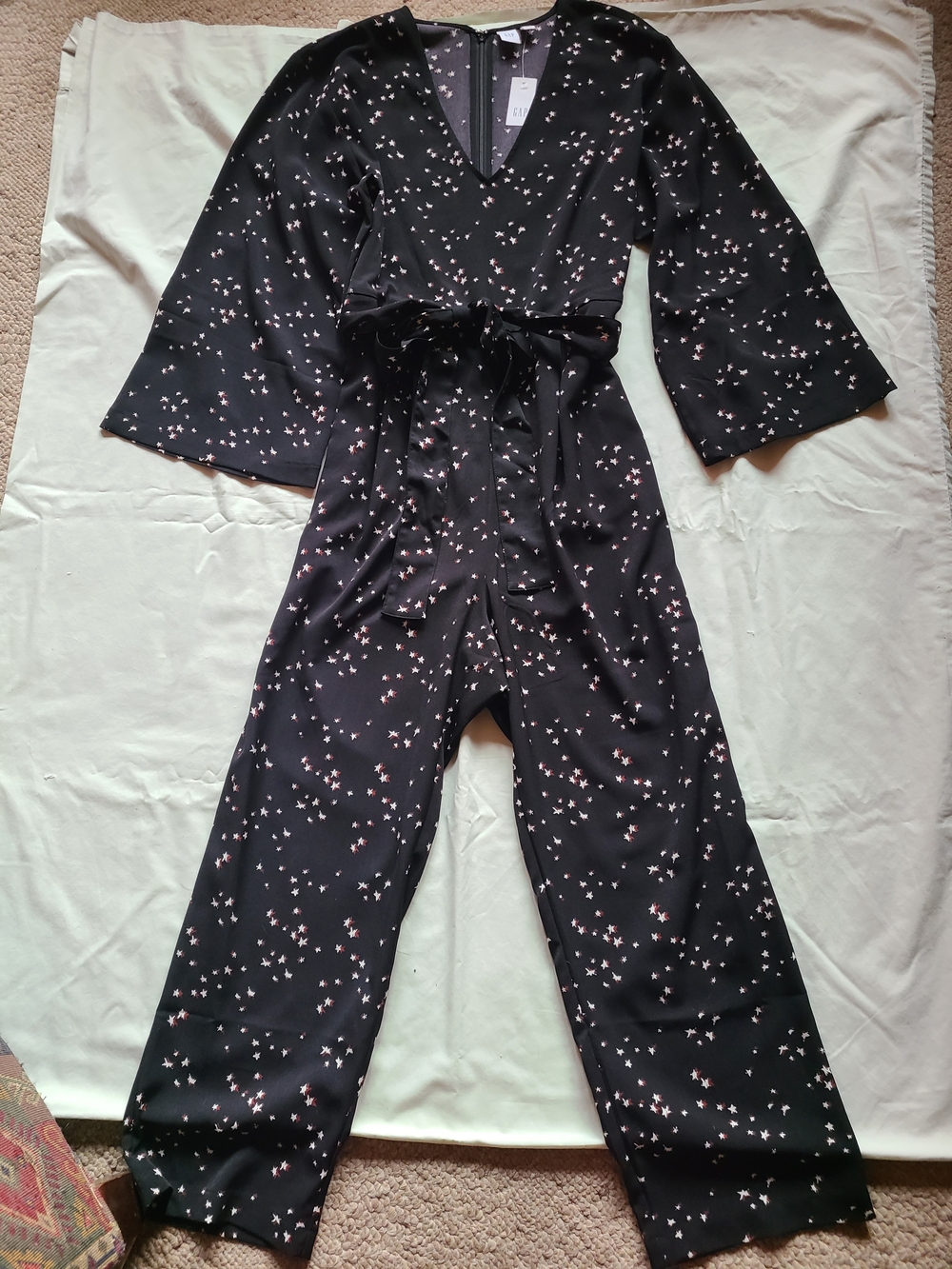 Gap Bell Sleeve black Jumpsuit with a white and reddish brown star print size 14